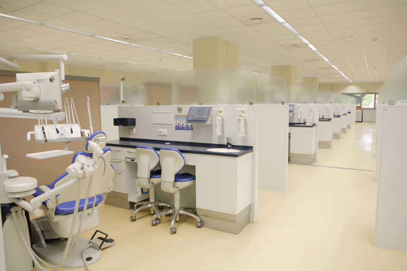 A row of dental treatment bays running the length of the URJC teaching clinic
